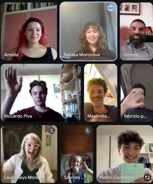 The nine team members waving during a video call